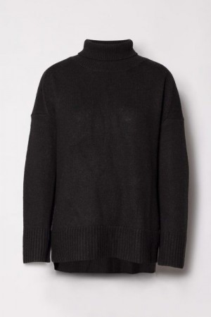 Cathrine Hammel praktfull sort oversized pologenser med splitt av YAK/merino